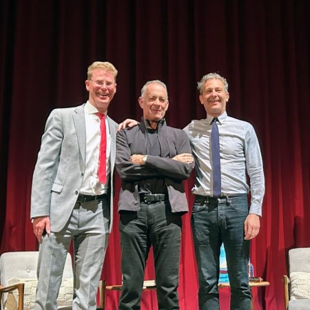 In May, Literary Arts Executive Director Andrew Proctor (left), joined author and actor Tom Hanks (center) and Portland author Jon Raymond at Keller Auditorium. Photo courtesy: Literary Arts