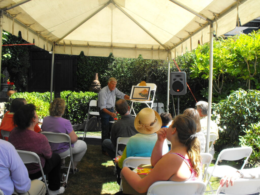 Pastel artist Steve Bennett of Jacksonville gives a demonstration in Micheal and Judy Gibbons' garden during the 2012 Toledo Art Walk. Judy Gibbons says Bennett and his artist wife, Sue Bennett, began coming to Toledo in 2007 and often rented an art studio/living space from them for several weeks to work plein air in the Yaquina Estuary. Photo courtesy: Judy Gibbons