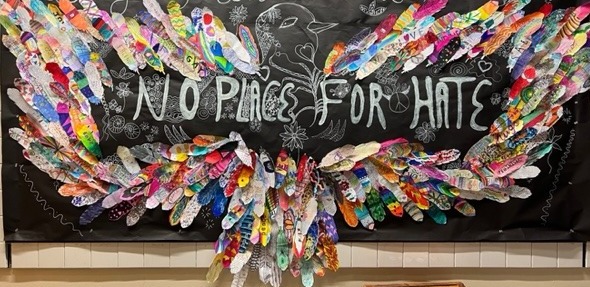 No Place For Hate, a feather mural created collaboratively by Cibyl Kavan's students. Photo courtesy of Cibyl Kavan.