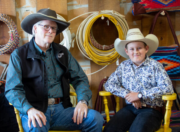 Cowboy poets Tom Swearingen of Tualatin and Thomas Fitzgerald, 12, of Prineville, will perform together Sept. 16 in Prineville in a benefit for an equine-assisted therapy program. The two met four years ago, when Swearingen offered to trade one of his CDs in exchange for hearing Thomas recite a poem. Photo by: D. "Bing" Bingham