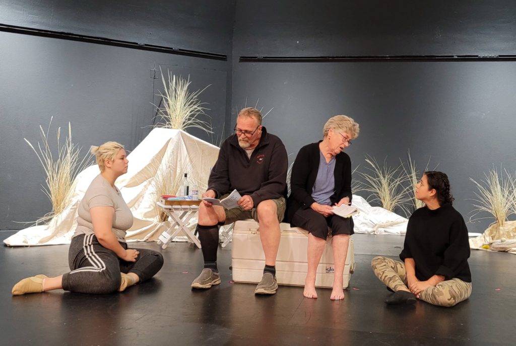 Cast members (from left) Ryan Reyes, Mark Johnson, Pia Shepherd, and Kenia Goodman rehearse a scene from “Seascape,” in which a long-married couple visit the beach and meet a pair of giant sea lizards.