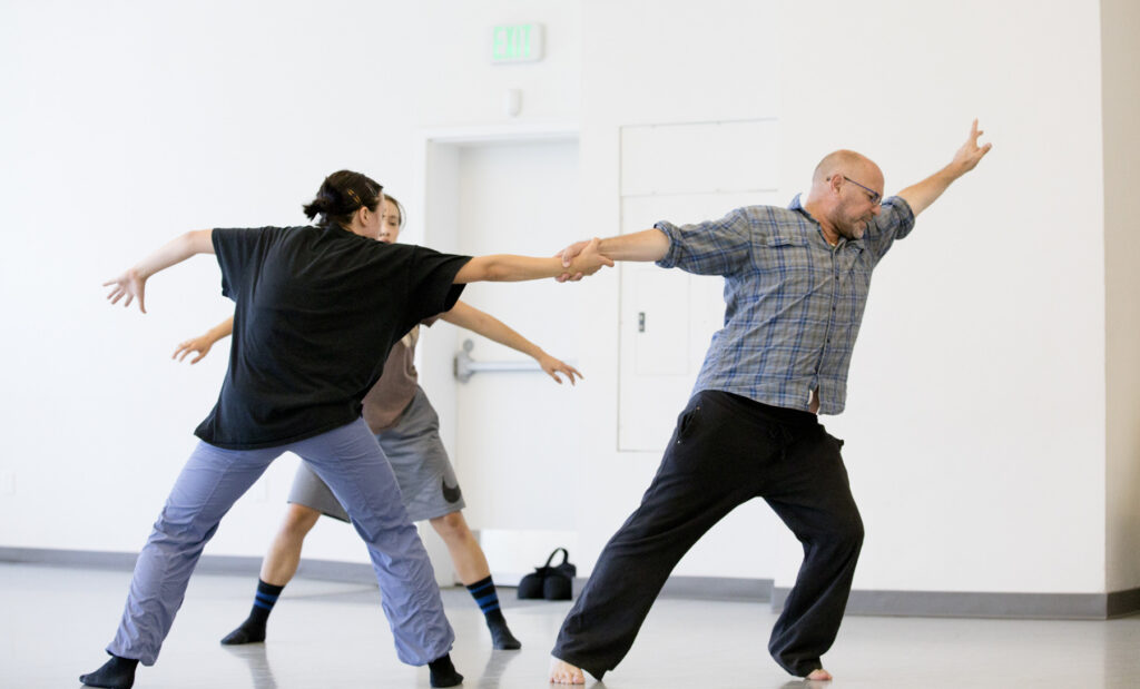Choreographer Serge Bennathan, right, exerting some push and pull in rehearsal. Photo: Blaine Truitt Covert