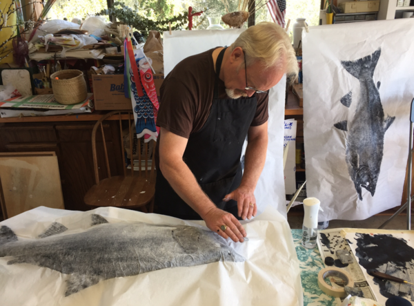 Duncan Berry works on a gyotaku print, or fish rubbing, in his studio.